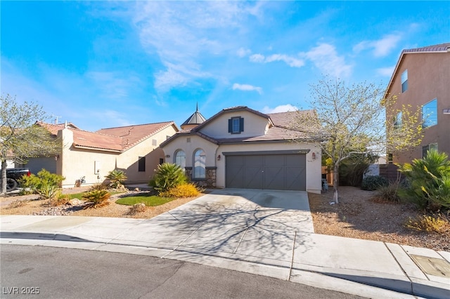 mediterranean / spanish-style house with driveway and stucco siding