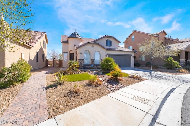 mediterranean / spanish-style house featuring a garage, a tile roof, driveway, and stucco siding