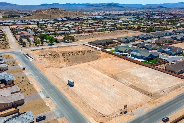 birds eye view of property with a residential view and a mountain view