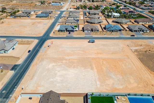 birds eye view of property with a residential view