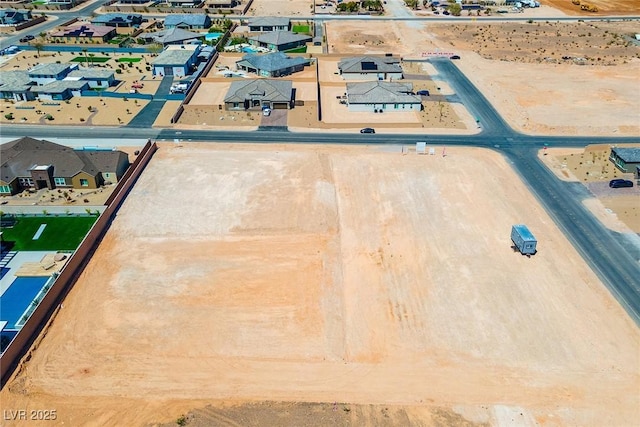 birds eye view of property with a residential view