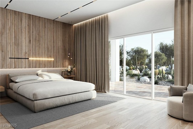 bedroom featuring light wood-style floors, access to outside, and wooden walls