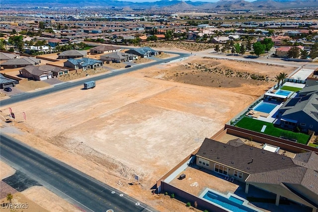 drone / aerial view featuring a mountain view