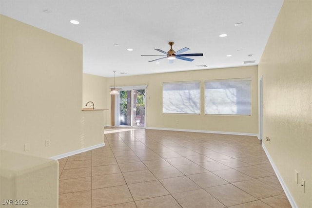 spare room featuring light tile patterned floors, visible vents, baseboards, ceiling fan, and recessed lighting