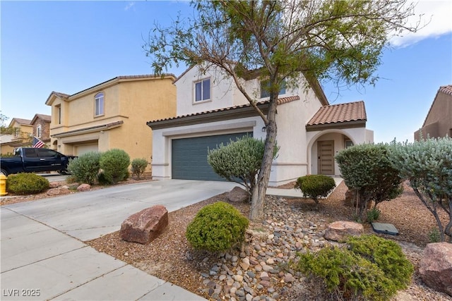 mediterranean / spanish-style home featuring a garage, concrete driveway, a tile roof, and stucco siding