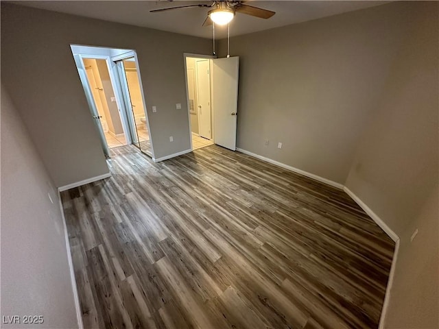 unfurnished bedroom featuring a ceiling fan, baseboards, and wood finished floors