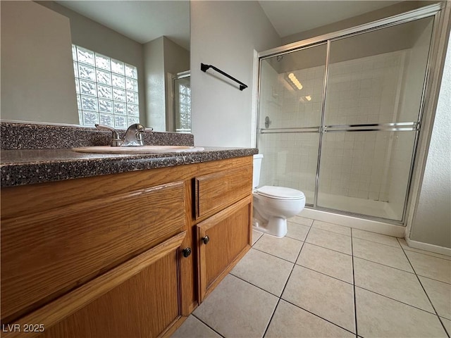 full bathroom with toilet, a stall shower, vanity, and tile patterned floors