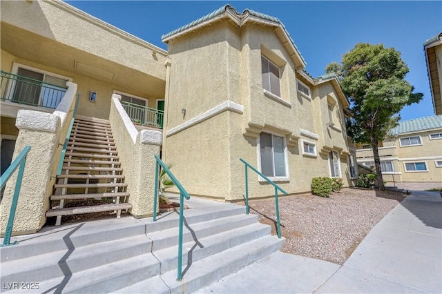 view of property featuring stairway