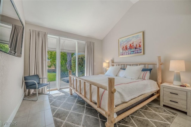 bedroom with lofted ceiling, access to outside, dark tile patterned floors, and baseboards