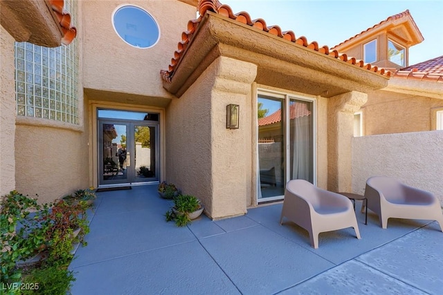 view of patio featuring french doors