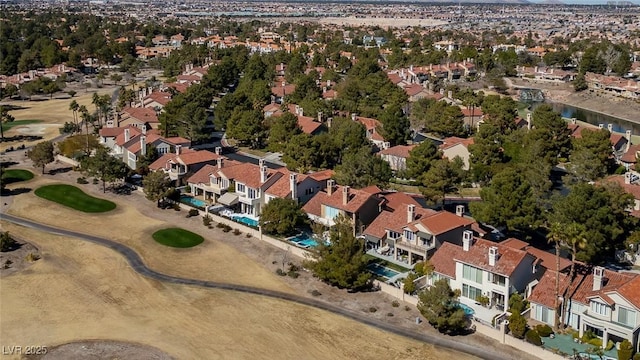 birds eye view of property featuring view of golf course and a residential view