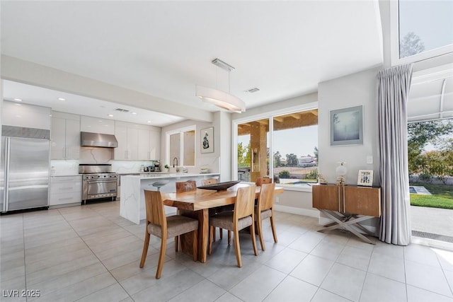 dining space featuring light tile patterned flooring, visible vents, and recessed lighting