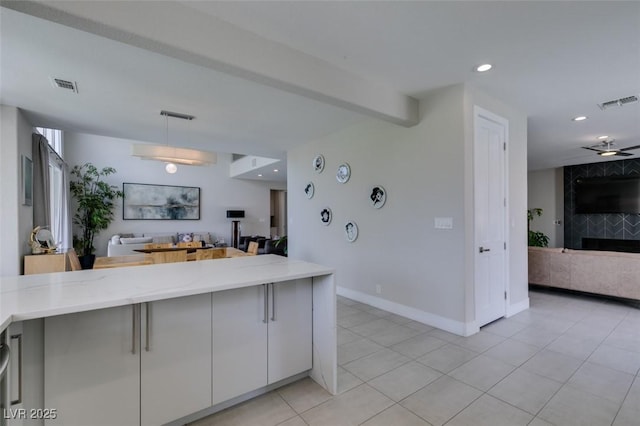 7999 Pinnacle Peak Ave, Las Vegas, NV 89113 - kitchen with open floor plan, light stone countertops, light tile patterned flooring, recessed lighting, and decorative light fixtures