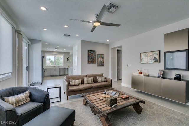 7999 Pinnacle Peak Ave, Las Vegas, NV 89113 - living room featuring light tile patterned flooring, recessed lighting, and a ceiling fan