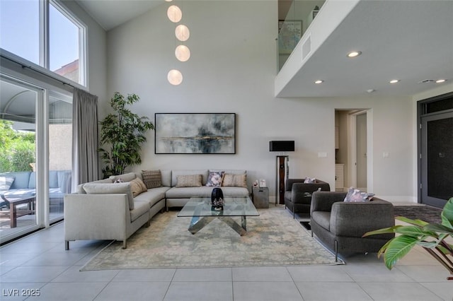 7999 Pinnacle Peak Ave, Las Vegas, NV 89113 - living room with high vaulted ceiling, healthy amount of natural light, tile patterned flooring, and recessed lighting