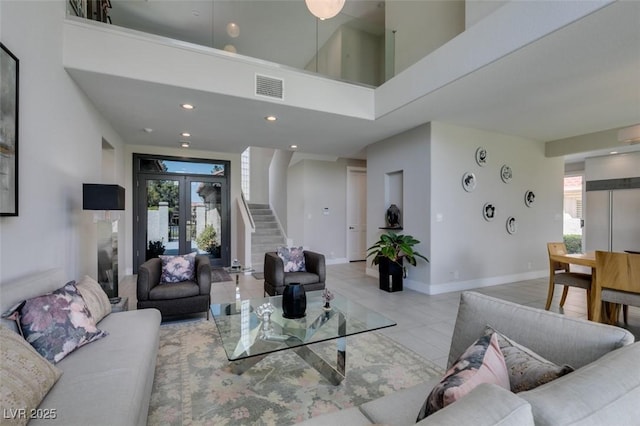 7999 Pinnacle Peak Ave, Las Vegas, NV 89113 - living room featuring stairs, light tile patterned flooring, a towering ceiling, baseboards, and recessed lighting