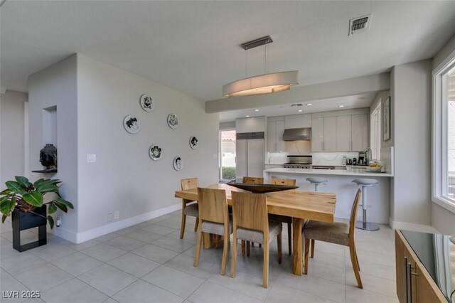 7999 Pinnacle Peak Ave, Las Vegas, NV 89113 - dining area featuring baseboards and light tile patterned floors