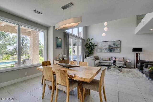 7999 Pinnacle Peak Ave, Las Vegas, NV 89113 - dining area with light tile patterned floors and baseboards