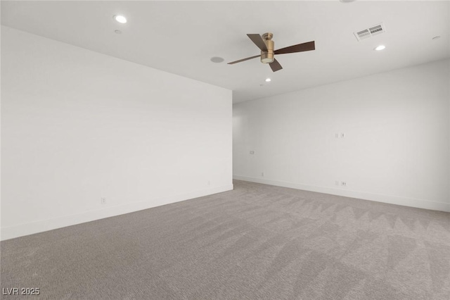 carpeted empty room with recessed lighting, visible vents, and baseboards