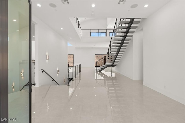 staircase with baseboards and recessed lighting