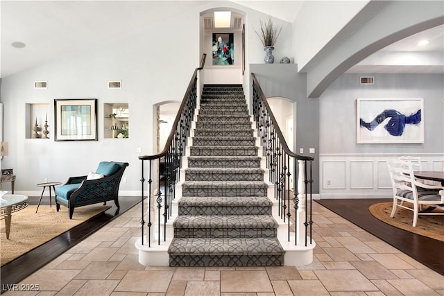 stairs with stone tile flooring and visible vents