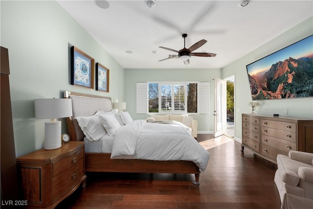 bedroom featuring ceiling fan, dark wood-type flooring, and baseboards