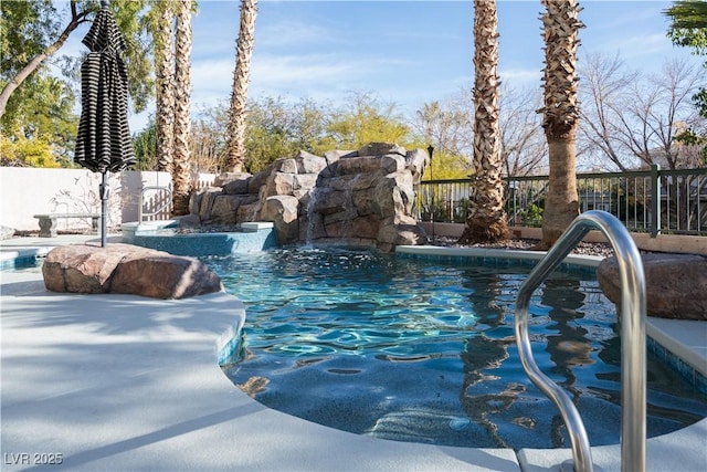 view of swimming pool with fence and a fenced in pool