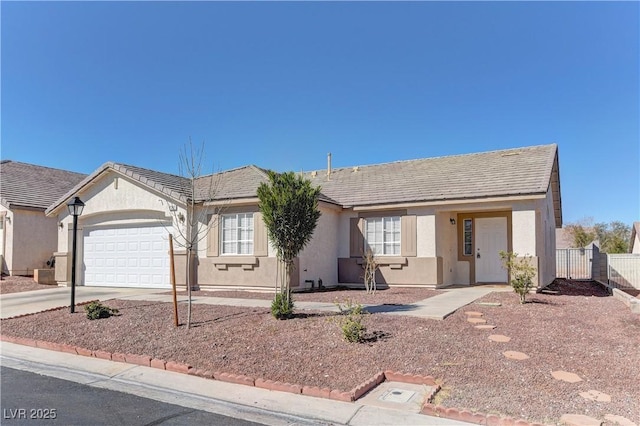 ranch-style house featuring a garage, driveway, a tiled roof, fence, and stucco siding