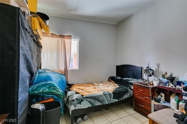 bedroom featuring light tile patterned floors