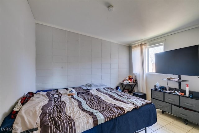 bedroom with light tile patterned floors