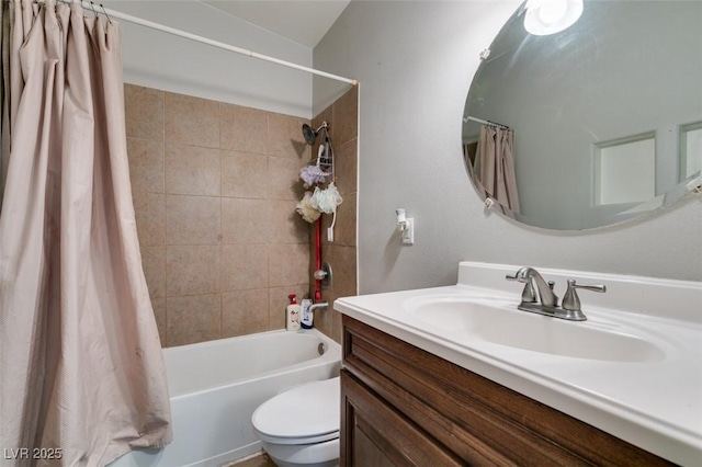 full bath with shower / bath combo, vanity, and toilet