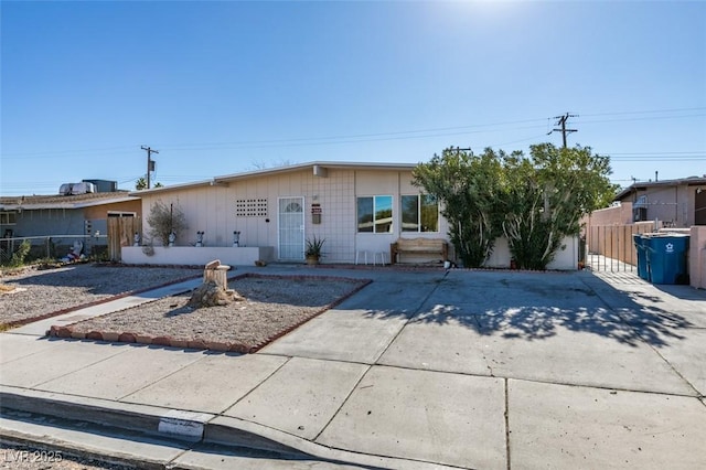 view of front of home featuring fence