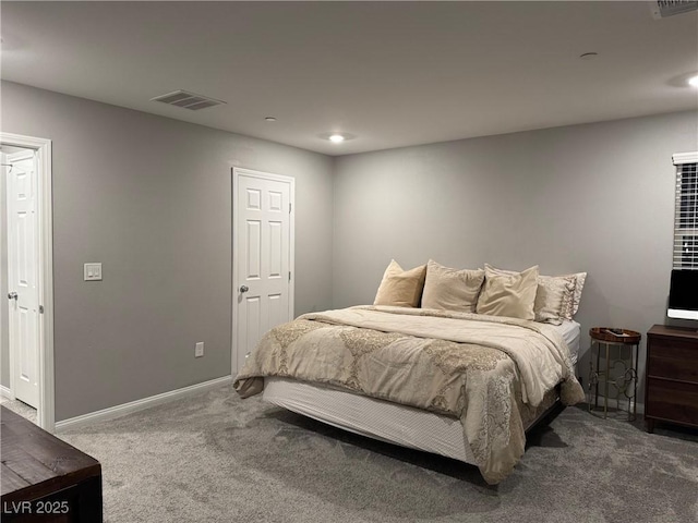 bedroom featuring dark colored carpet, visible vents, and baseboards