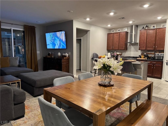 dining room with light tile patterned floors, visible vents, and recessed lighting