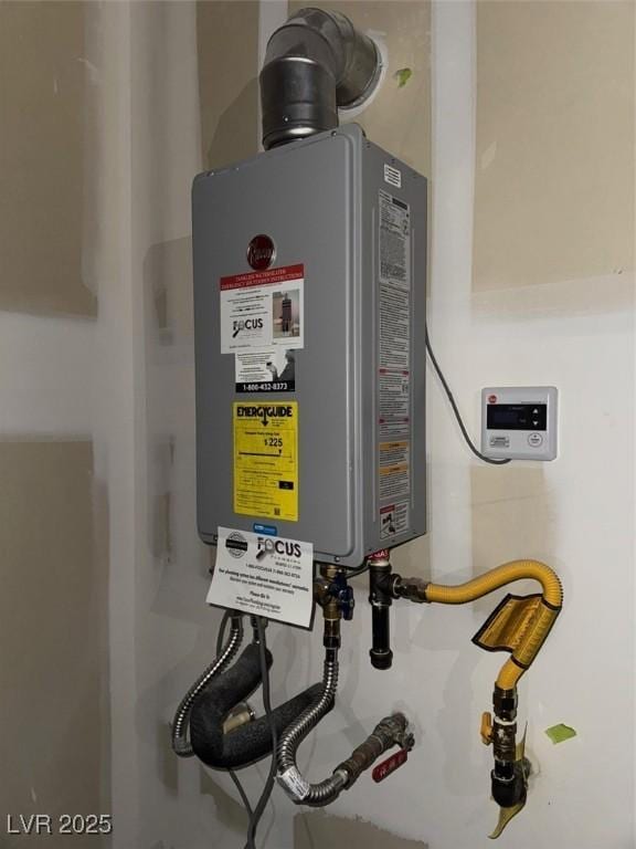 utility room featuring water heater