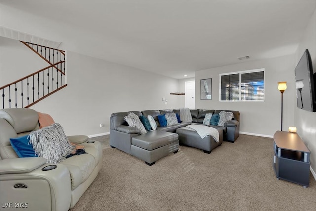 living area with baseboards, visible vents, stairway, and carpet flooring