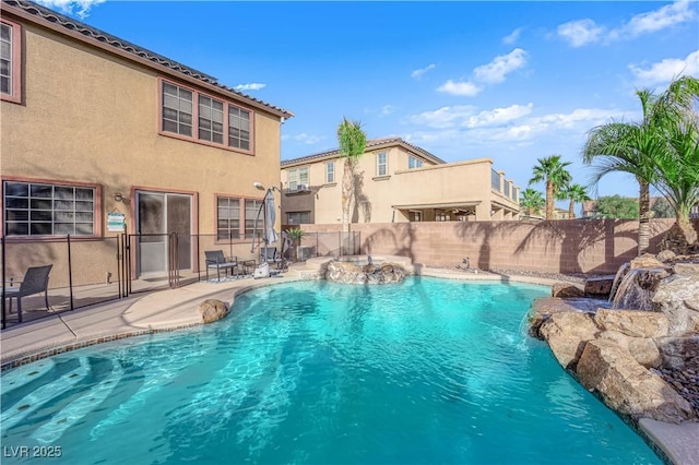 view of swimming pool with a fenced backyard and a fenced in pool