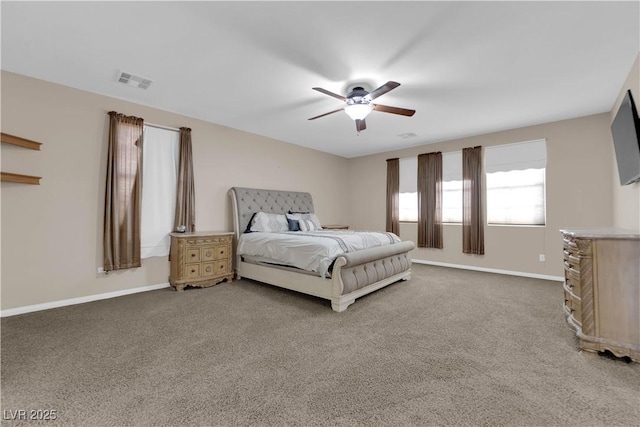 bedroom with carpet, visible vents, baseboards, and ceiling fan