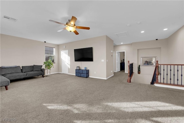 living room featuring recessed lighting, carpet, visible vents, and baseboards