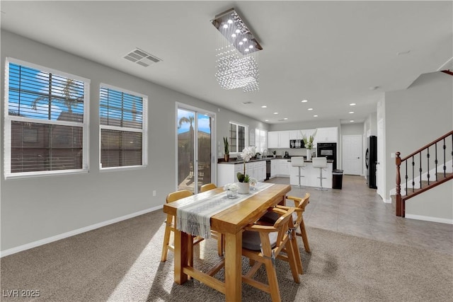 dining space featuring recessed lighting, visible vents, baseboards, stairway, and carpet