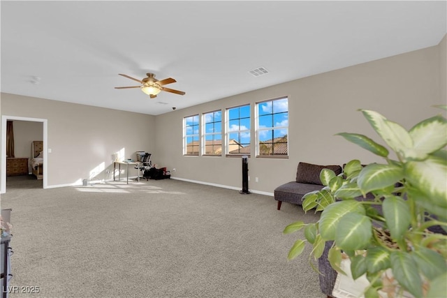 interior space featuring carpet, visible vents, ceiling fan, and baseboards