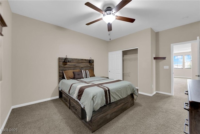 carpeted bedroom with ceiling fan, a closet, and baseboards