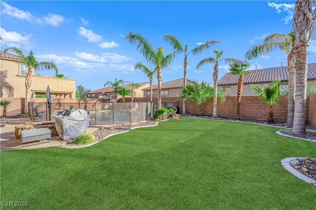 view of yard featuring a fenced backyard