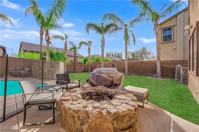 view of patio / terrace featuring a fire pit, a fenced backyard, and a grill