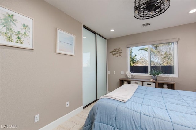 bedroom with baseboards, visible vents, and recessed lighting