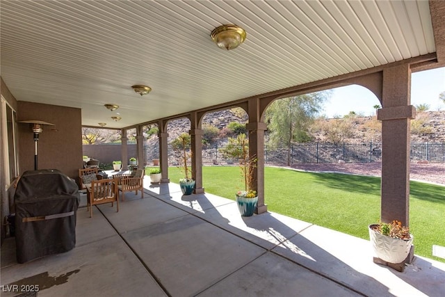 view of patio / terrace with a fenced backyard and a grill