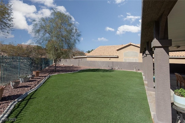 view of yard featuring a fenced backyard