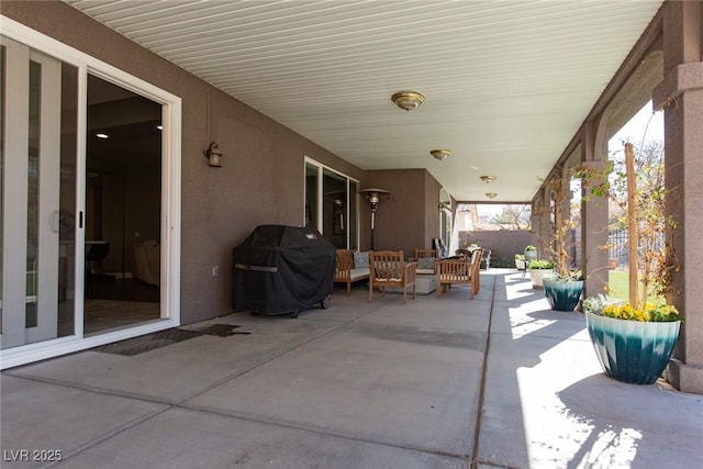 view of patio / terrace with outdoor lounge area, fence, and grilling area