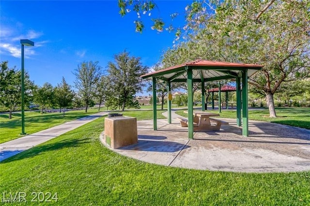 view of property's community featuring a lawn and a gazebo