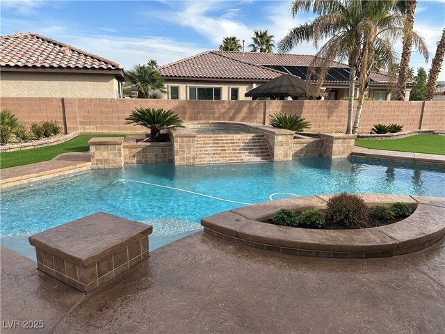 view of pool featuring an in ground hot tub, a fenced backyard, and a fenced in pool